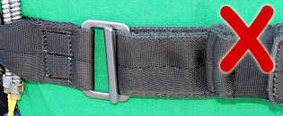 WRONG! – Chest strap needs to go around the friction adapter first (vertical bar)