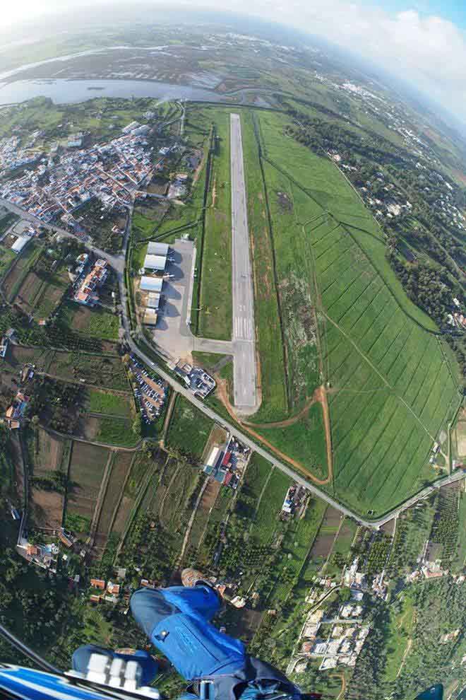 The back-to-back landing area is the grass strip between the hangars and the runway