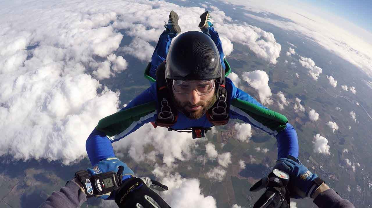For your first jump, do a solo or a coached skydive