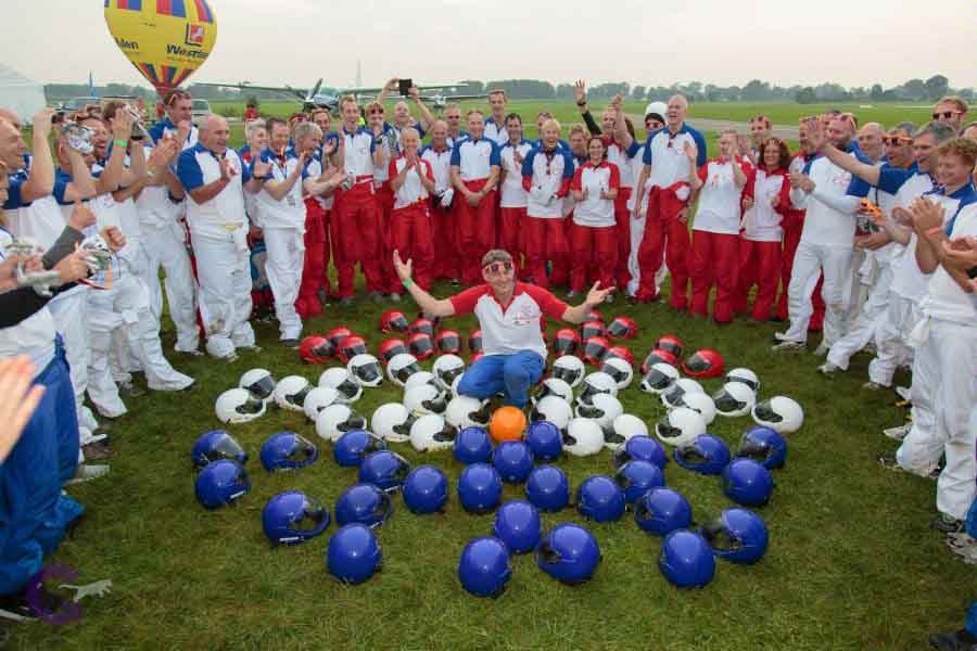 Event Organizer Henny Wiggers on the formation made of sponsored helmets