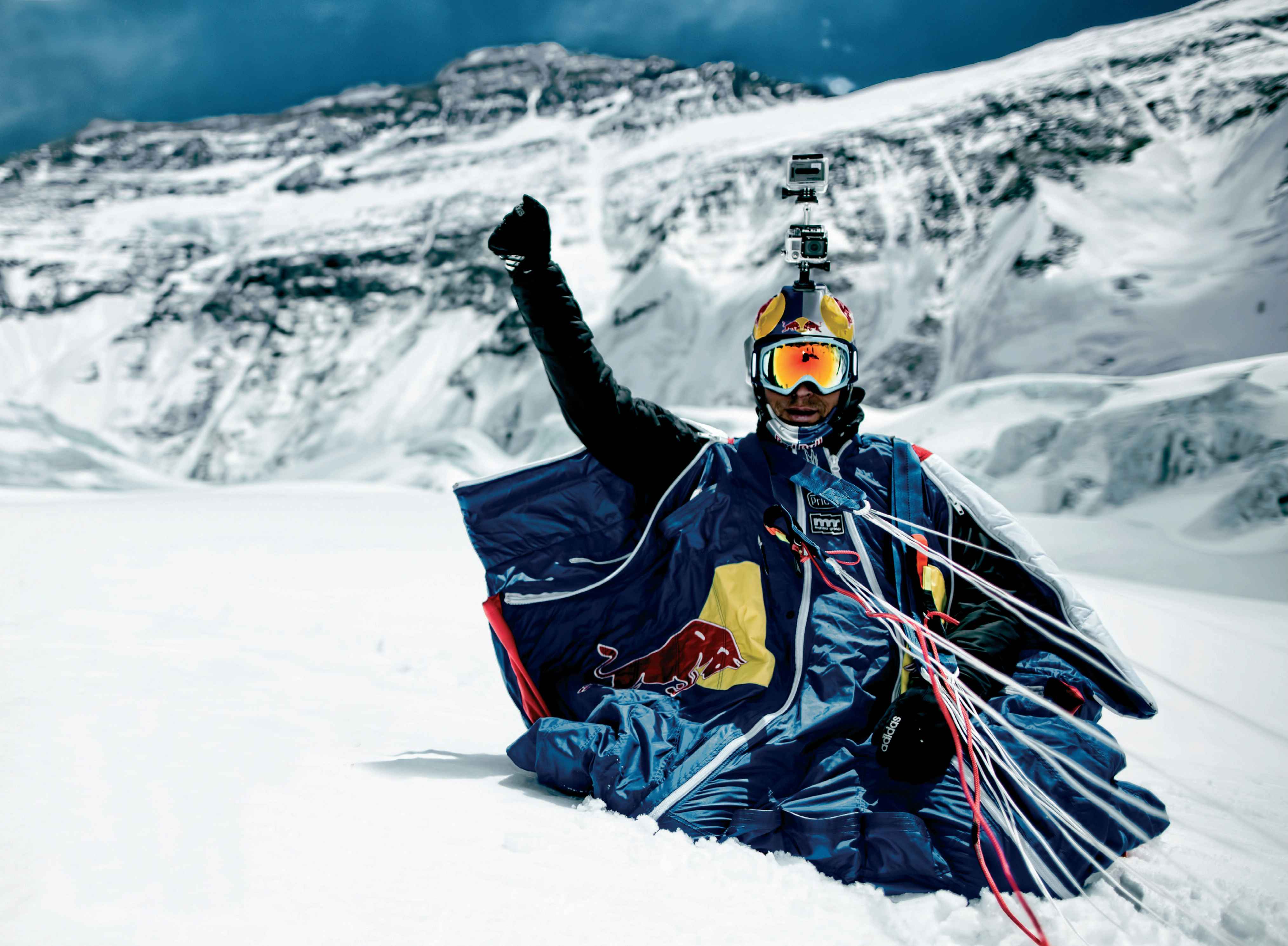 A triumphant Valery raises his hand after landing