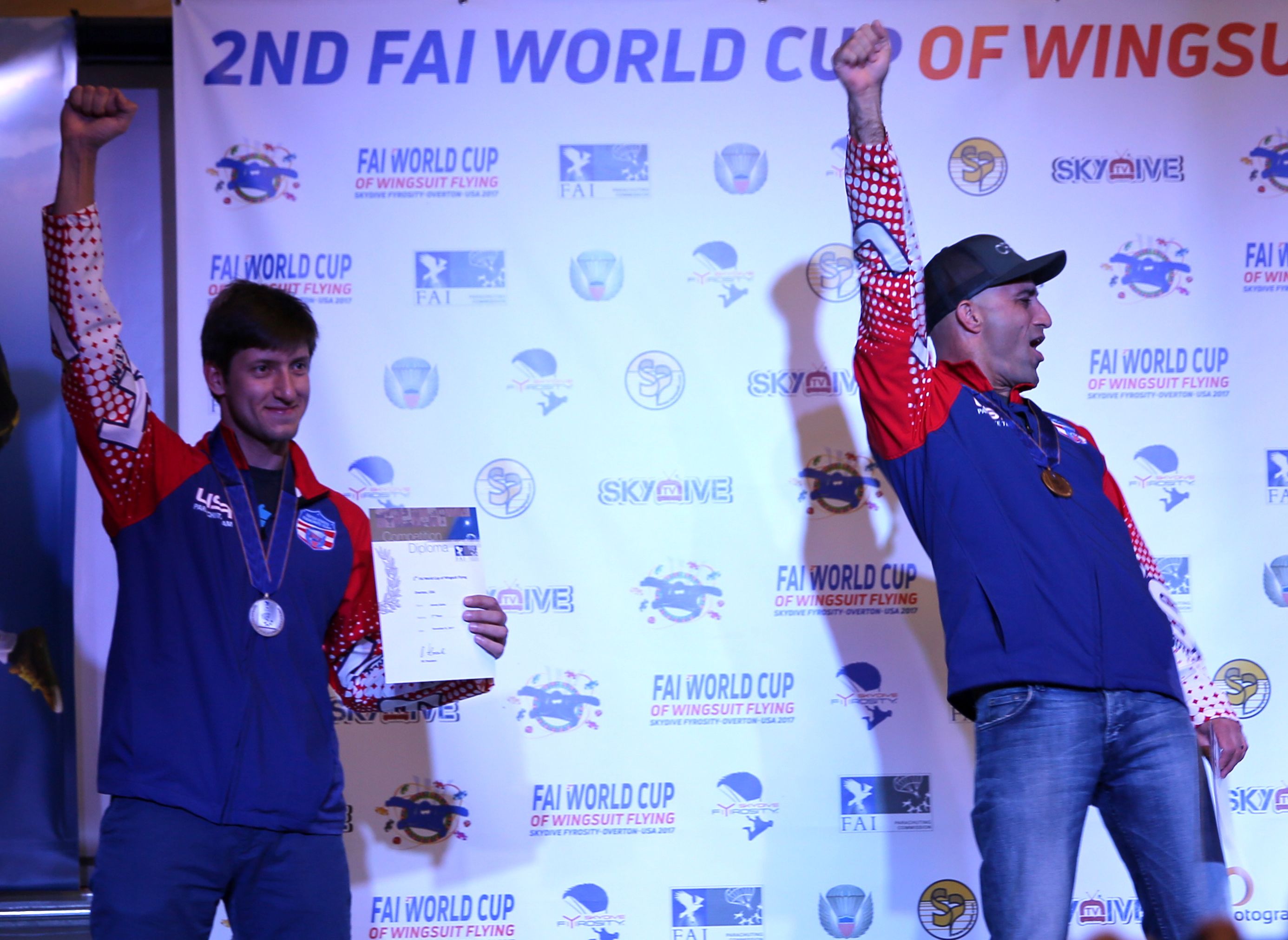 Alexey Galda and Chris Geiler celebrate their silver and gold medals