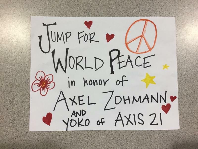 Make a sign to join the World Peace jump for Axel and Yoko